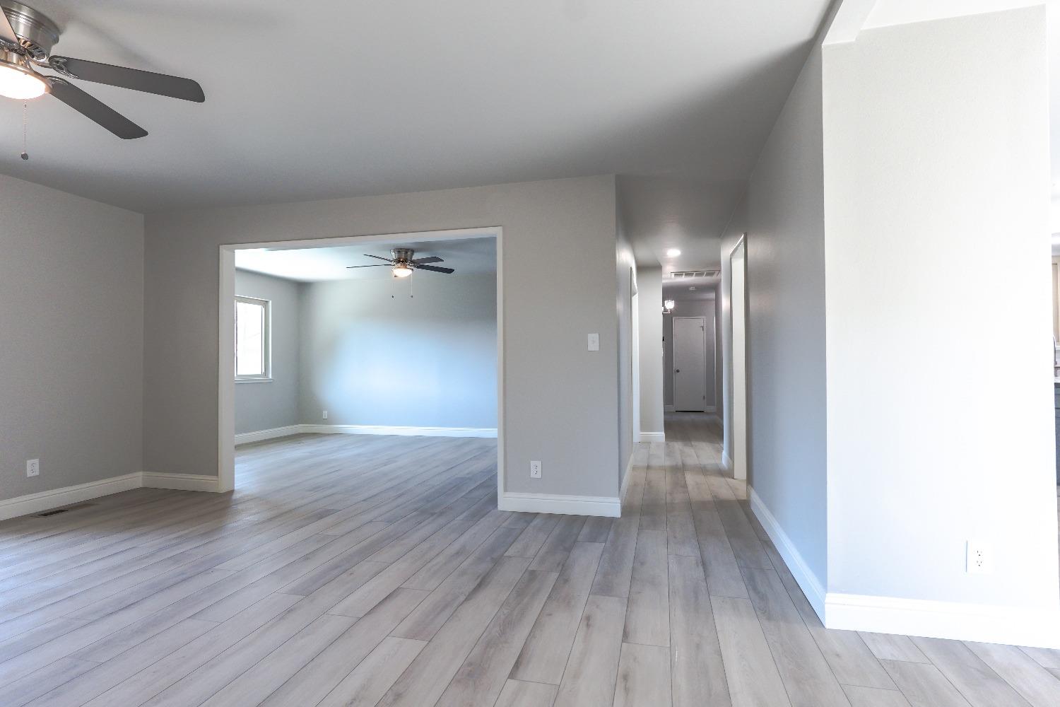 6587 North First Street Fresno, CA 93710 - Photo 12 of 51 a view of empty room with wooden floor