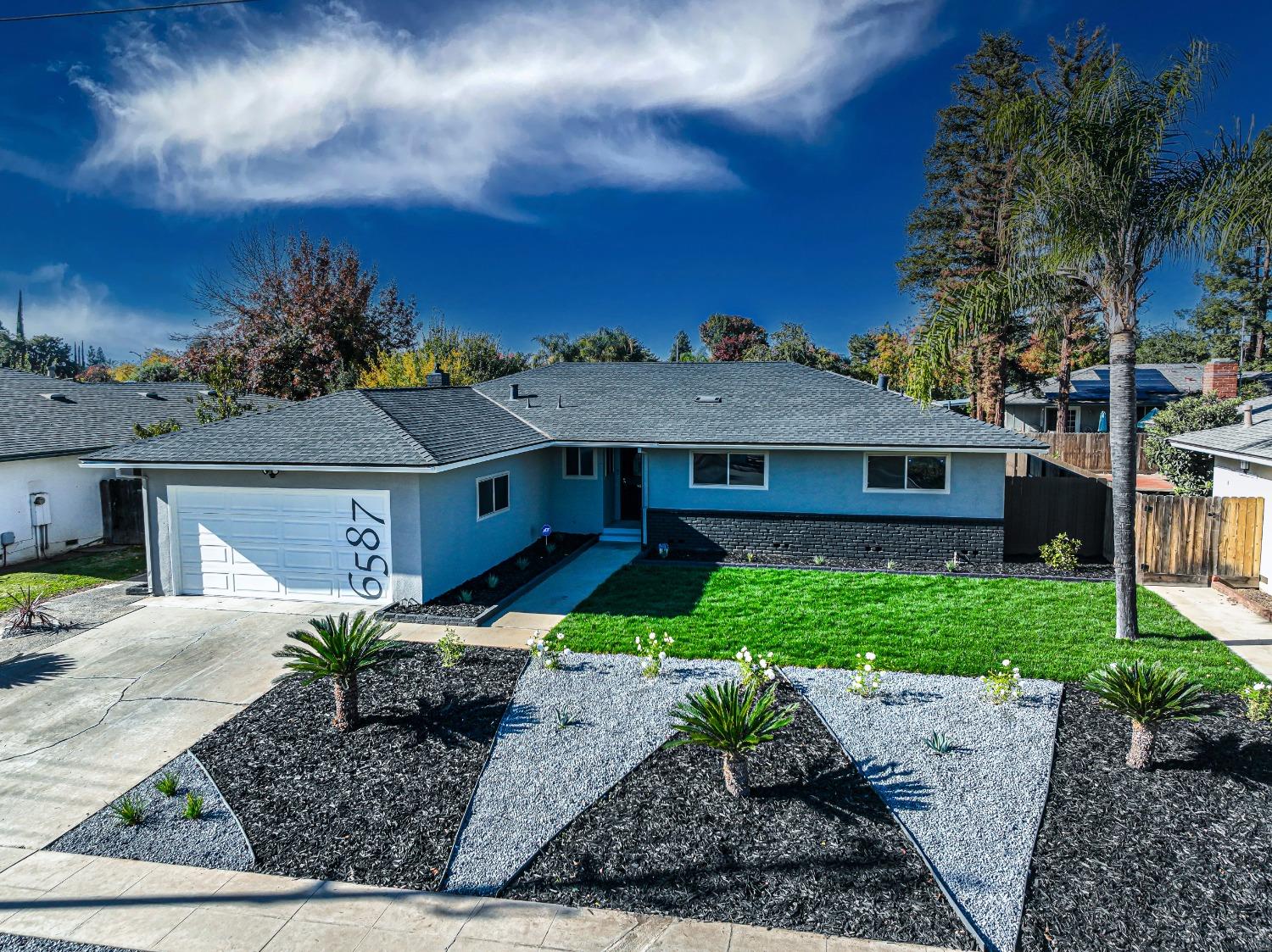6587 North First Street Fresno, CA 93710 - Photo 2 of 51 a view of a house with a patio