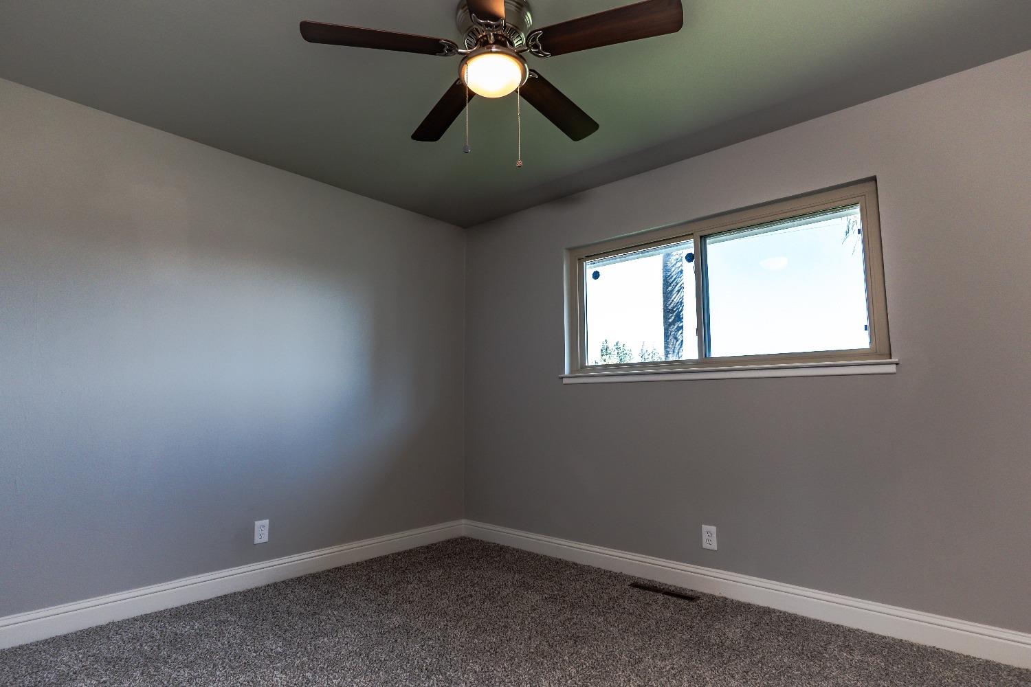 6587 North First Street Fresno, CA 93710 - Photo 24 of 51 a view of room with window and ceiling fan