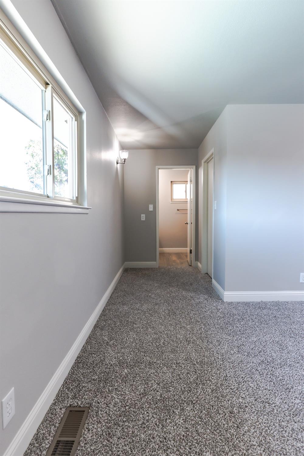 6587 North First Street Fresno, CA 93710 - Photo 31 of 51 an empty room with windows and closet