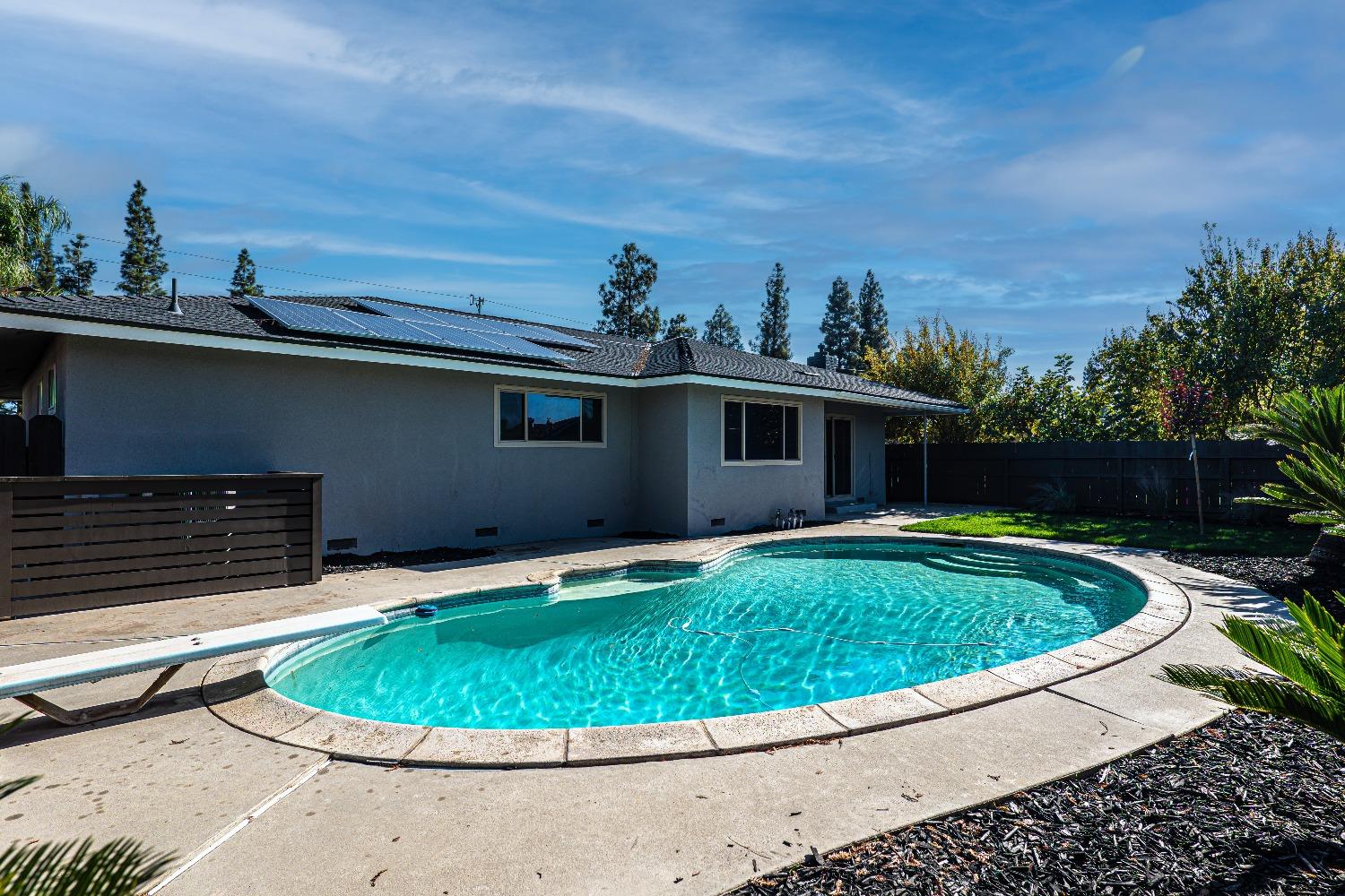 6587 North First Street Fresno, CA 93710 - Photo 43 of 51 a small pool with lawn chairs