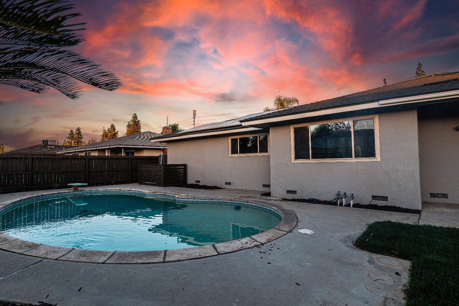 6587 North First Street Fresno, CA 93710 - Photo 48 of 51 a view of a backyard with plants and barbeque grill