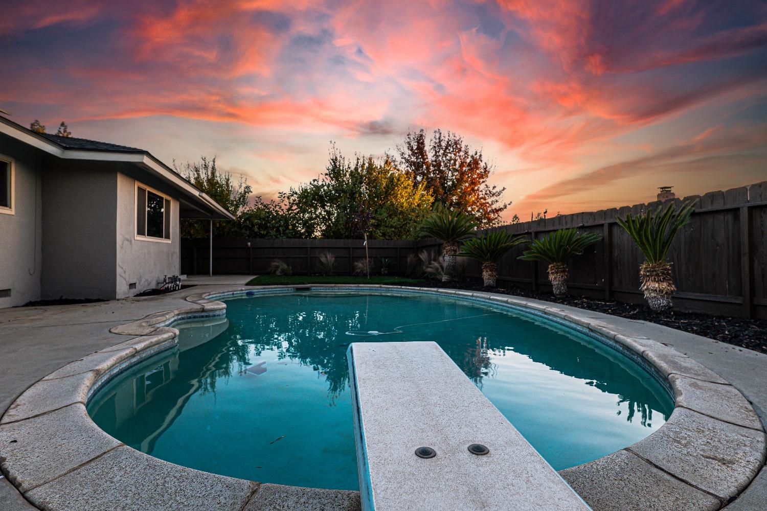 6587 North First Street Fresno, CA 93710 - Photo 49 of 51 a view of a swimming pool with a yard