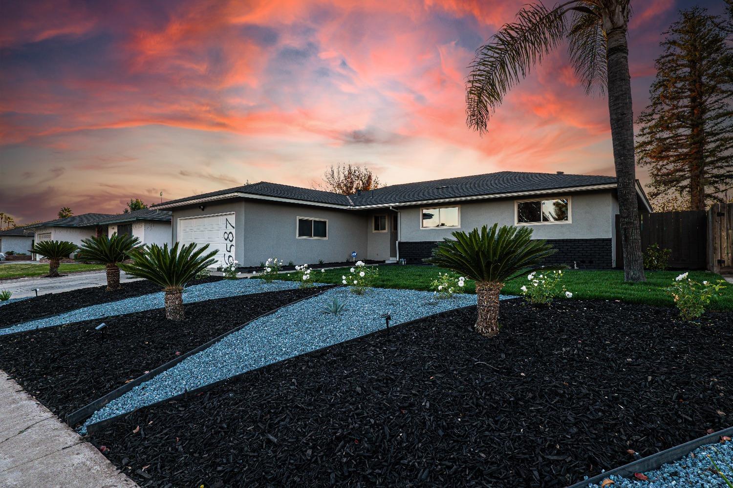 6587 North First Street Fresno, CA 93710 - Photo 5 of 51 a view of a house with a yard