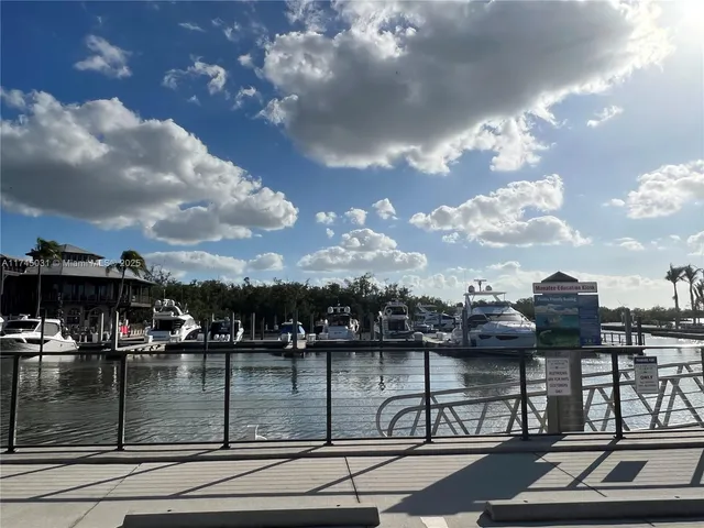 a view of a fire pit with lots of plants and trees