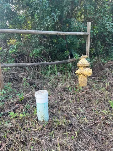 a view of a street with a building in the background