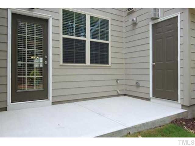 748 Wickham Ridge Road, Unit 115 Apex, NC 27539 - Photo 20 of 25 Backyard with private patio and exterior storage! (Photo of like design. Colors/selections may vary - ask onsite agent for details.)