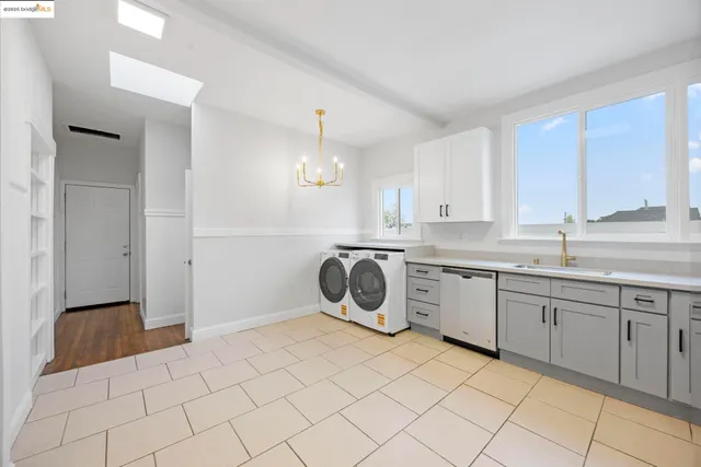 a kitchen with a sink cabinets and window