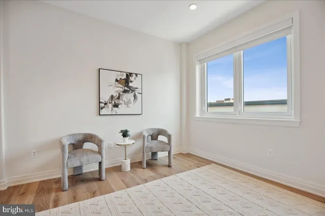 a room with a bed and a table in it