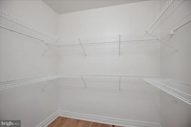 a bathroom with a shower a toilet and sink