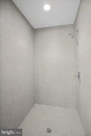 a kitchen with a refrigerator and cabinets