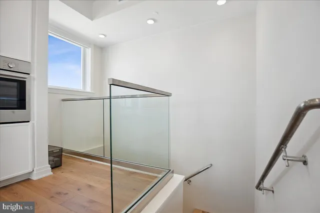a kitchen with stainless steel appliances granite countertop a stove and a microwave
