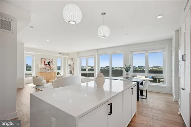 a kitchen with appliances a sink and cabinets
