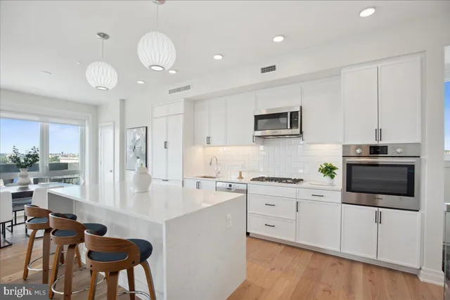 a kitchen with a sink and stove