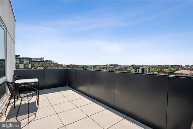 a workspace with furniture and a potted plant