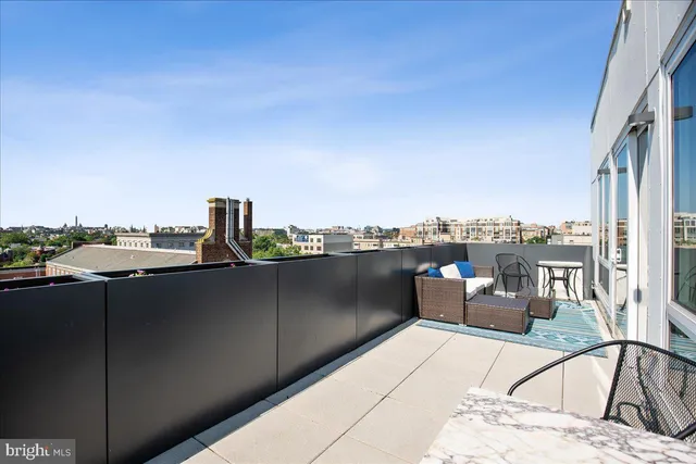 a bedroom with a bed and a chair