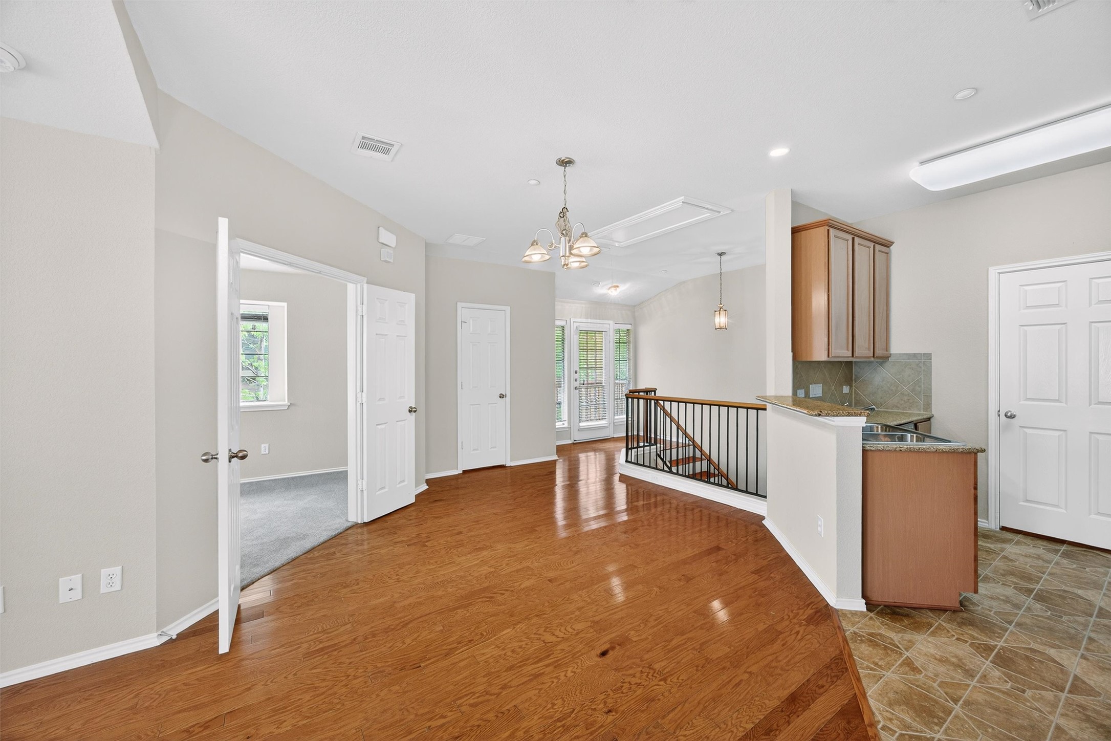 1310 West Parmer Lane, Unit 601 Austin, TX 78727 - Photo 11 of 40 a view of a kitchen with a sink and a refrigerator