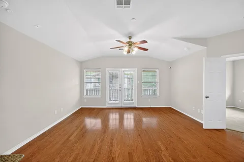 a kitchen with granite countertop a sink stove and cabinets