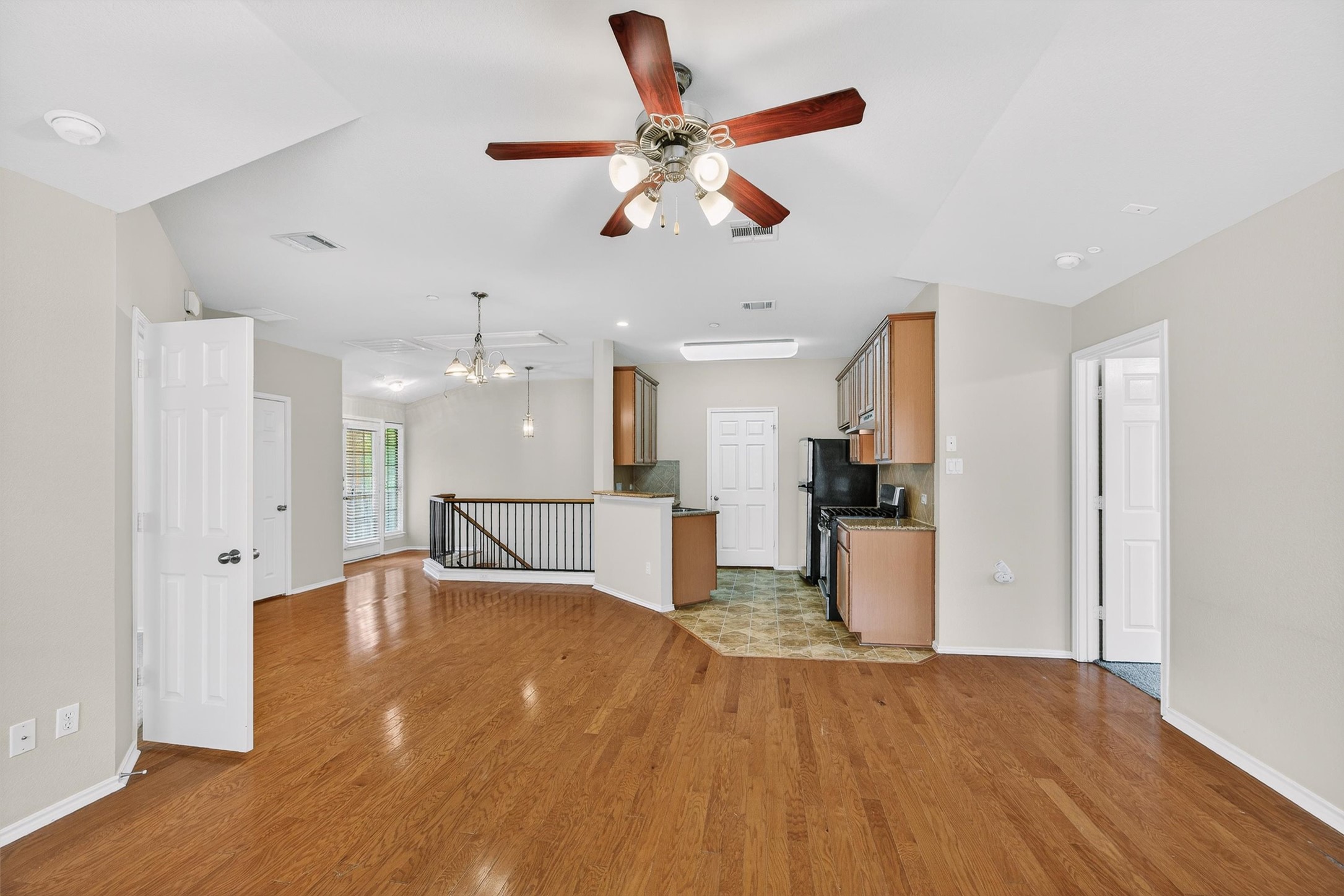1310 West Parmer Lane, Unit 601 Austin, TX 78727 - Photo 40 of 40 a view of a livingroom with a kitchen and a ceiling fan