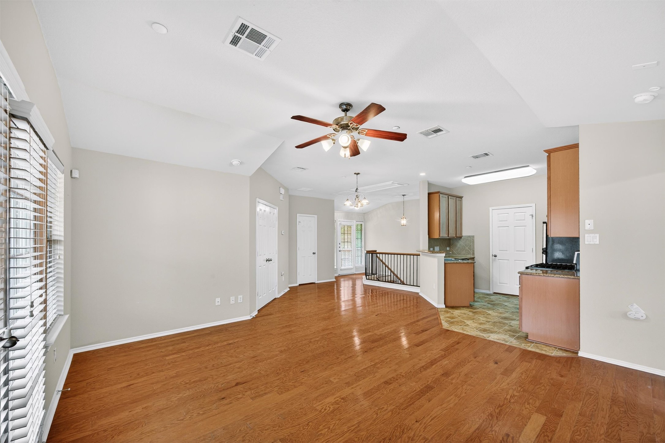 1310 West Parmer Lane, Unit 601 Austin, TX 78727 - Photo 19 of 40 a view of a kitchen with a sink and a refrigerator