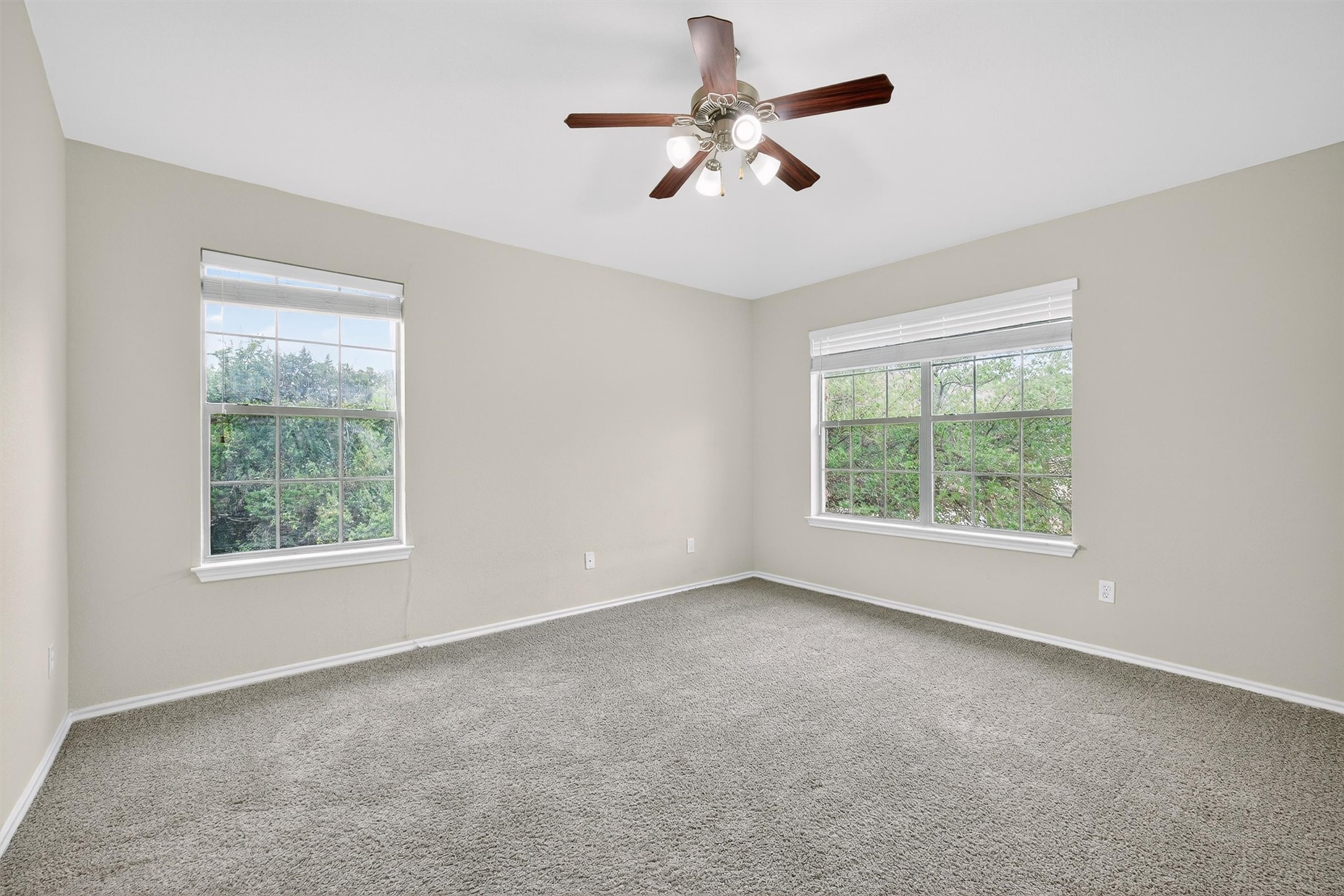 1310 West Parmer Lane, Unit 601 Austin, TX 78727 - Photo 24 of 40 an empty room with a window and a fan