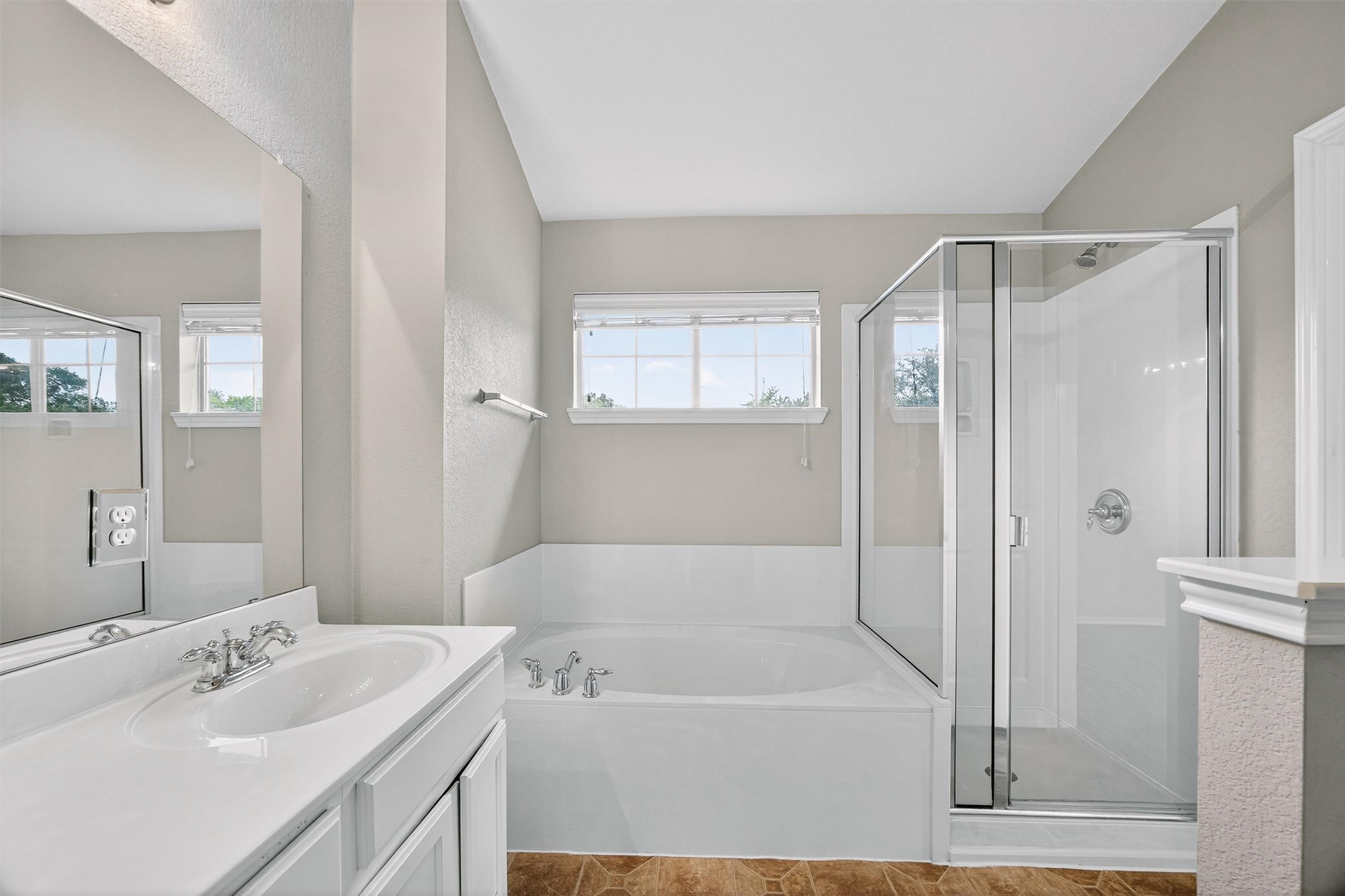 1310 West Parmer Lane, Unit 601 Austin, TX 78727 - Photo 27 of 40 a bathroom with a tub sink shower and mirror