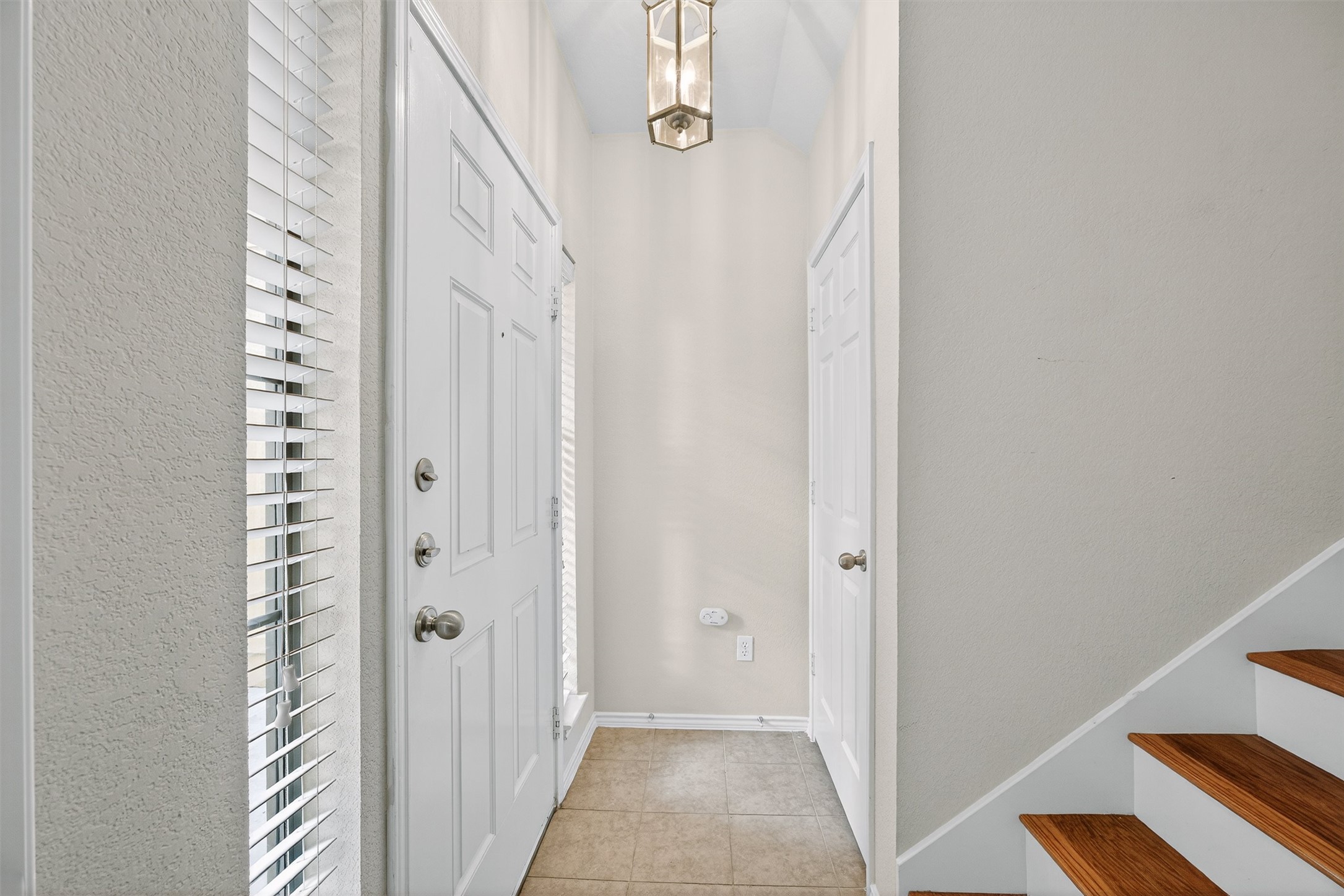 1310 West Parmer Lane, Unit 601 Austin, TX 78727 - Photo 31 of 40 a view of a hallway with wooden floor and entryway