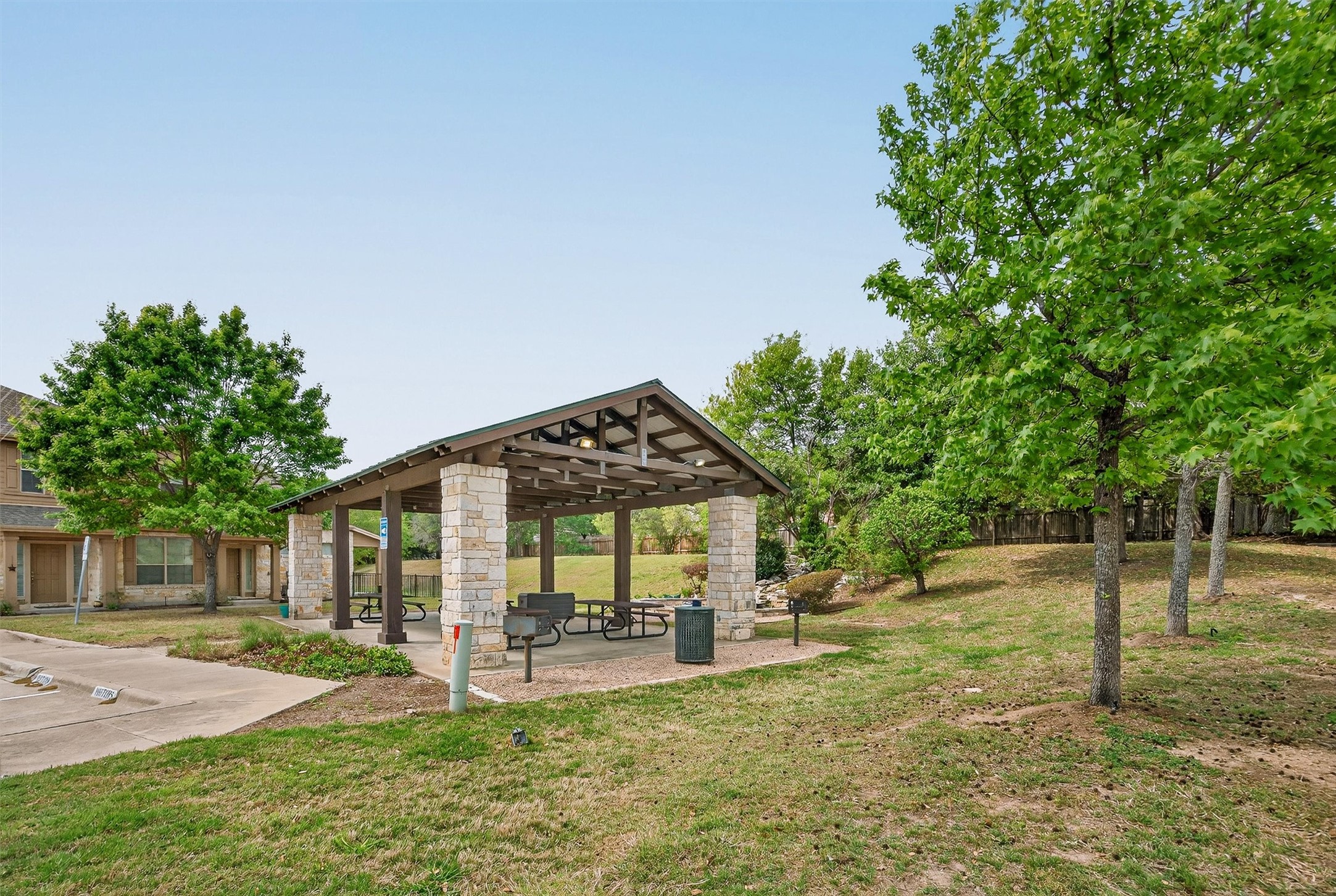 1310 West Parmer Lane, Unit 601 Austin, TX 78727 - Photo 34 of 40 a view of a house with backyard and a tree
