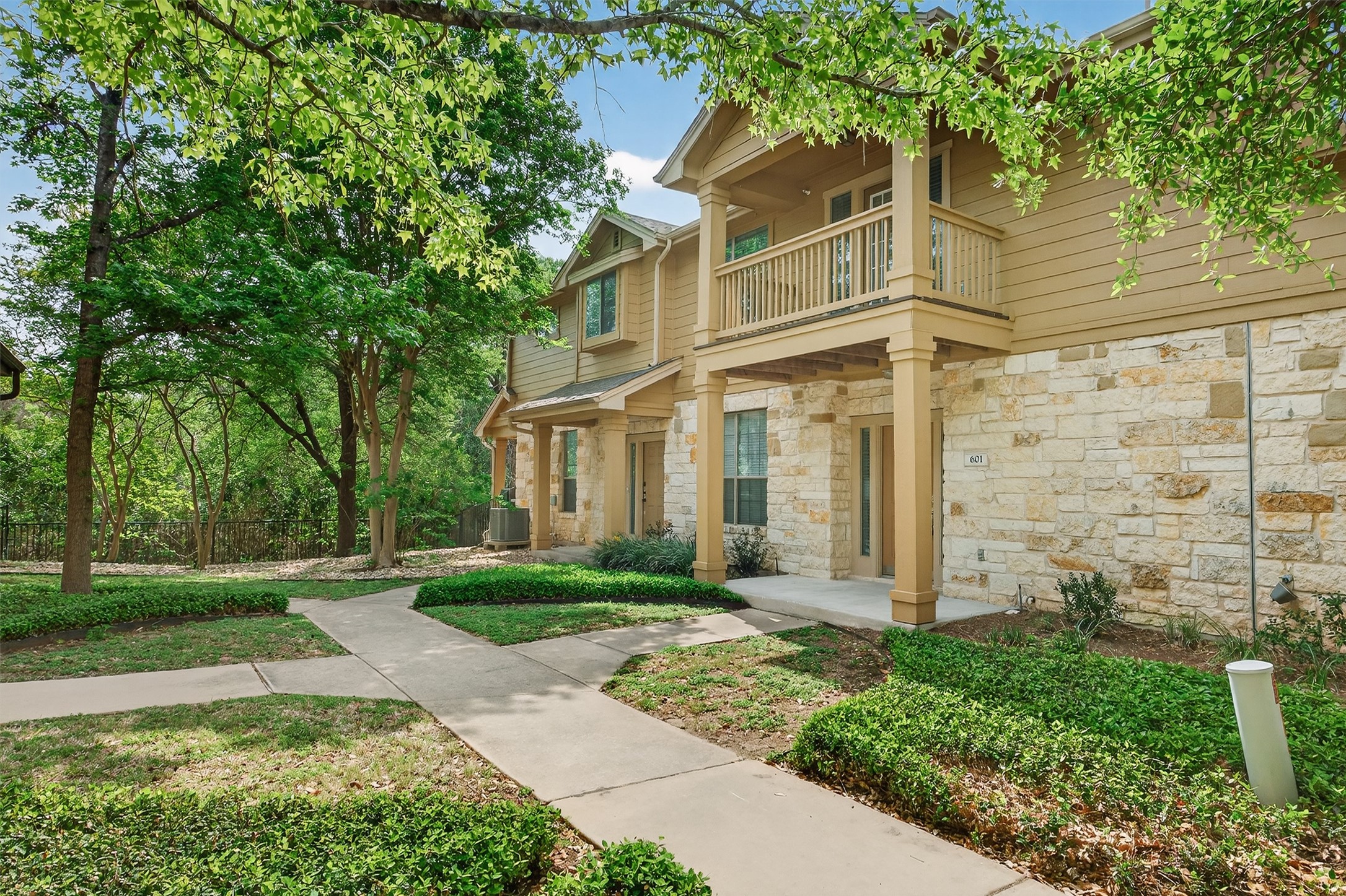 1310 West Parmer Lane, Unit 601 Austin, TX 78727 - Photo 35 of 40 front view of a house with a yard