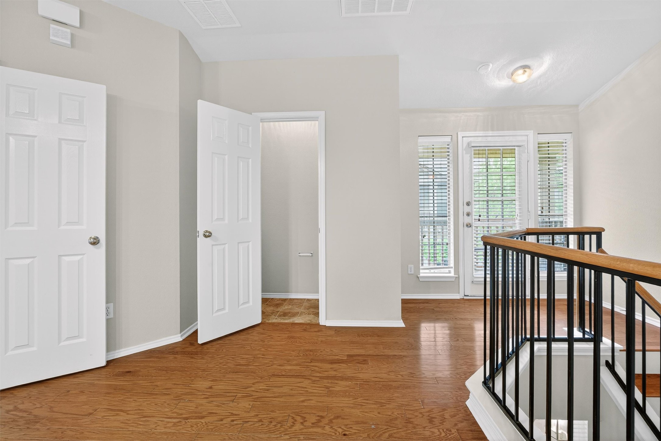 1310 West Parmer Lane, Unit 601 Austin, TX 78727 - Photo 6 of 40 a view of a room with wooden floor and windows
