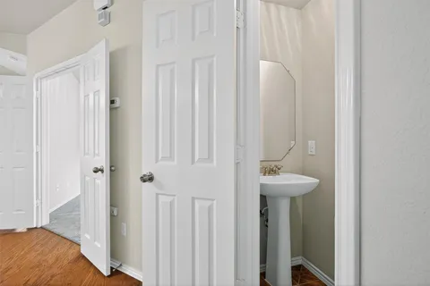 a bathroom with a sink and mirror