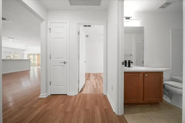 a view of bathroom with a sink and mirror