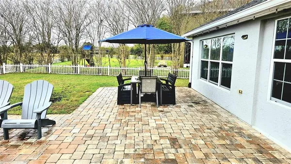a view of a swimming pool with a patio