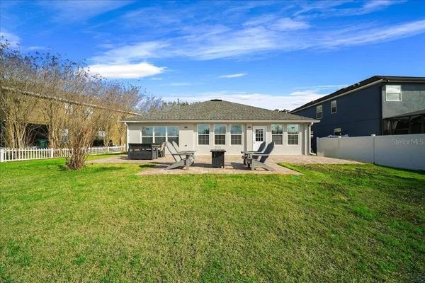 a front view of a house with yard patio and fire pit