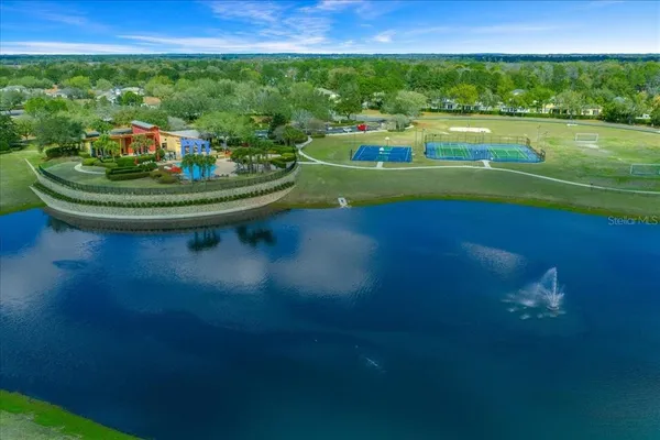 a view of a swimming pool and a yard