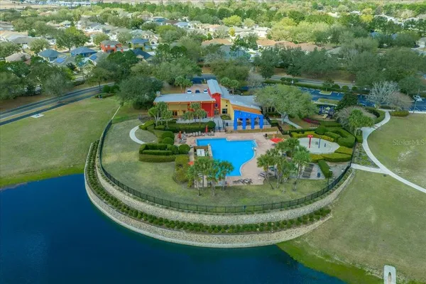 a view of a swimming pool with a yard