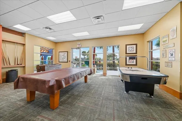 a room with lots of furniture and windows