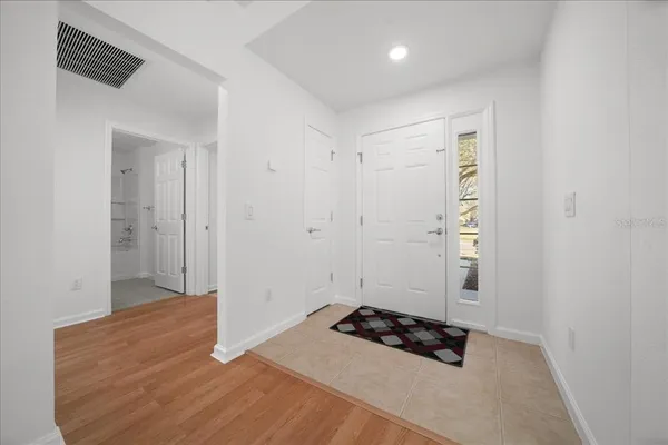 a room that has a bed and a dresser in it