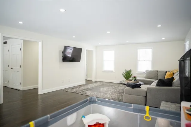 a kitchen with granite countertop a sink stainless steel appliances and cabinets