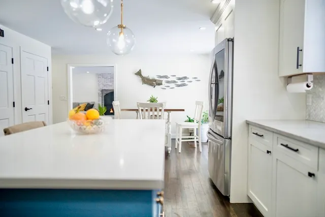 a living room with furniture a window and gym equipment