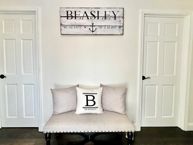 a kitchen with a table chairs sink and cabinets