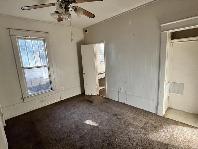 a view of an empty room with a window