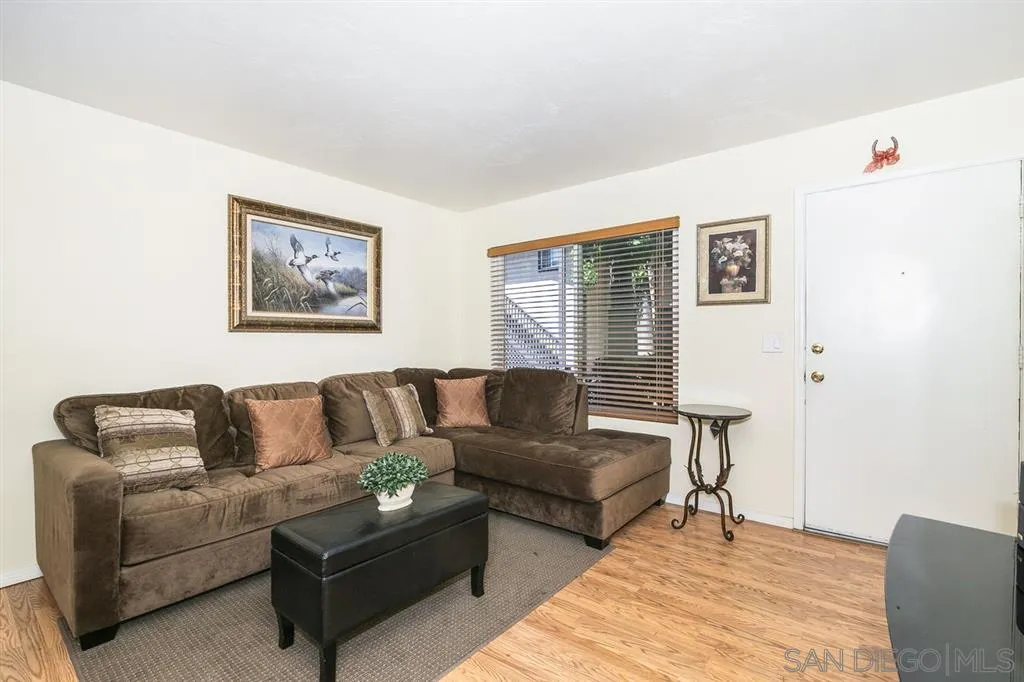 10321 Carefree Drive Santee, CA 92071 - Photo 4 of 22 a living room with couches and painting on the wall