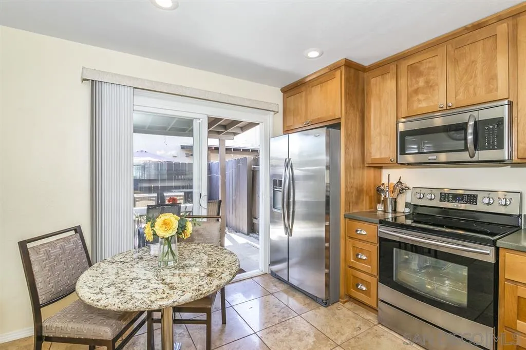 10321 Carefree Drive Santee, CA 92071 - Photo 8 of 22 a kitchen with a sink a refrigerator and a stove