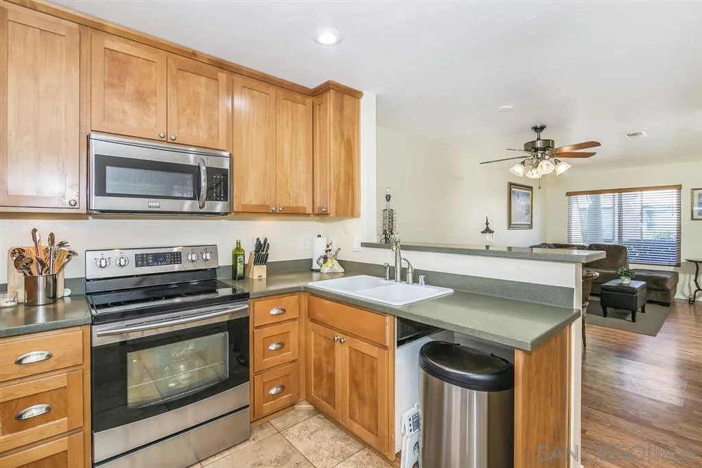 10321 Carefree Drive Santee, CA 92071 - Photo 10 of 22 a kitchen with a stove and a microwave