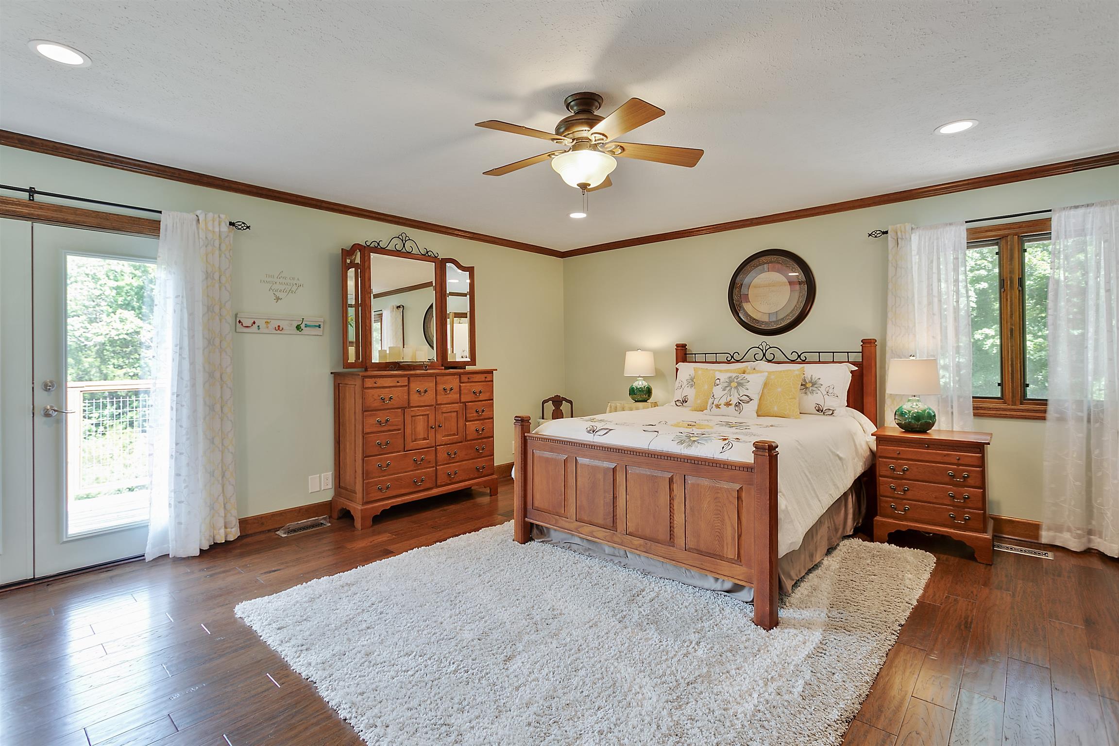 1534 Iron Bridge Road Columbia, TN 38401 - Photo 19 of 30 a bedroom with a bed and a chandelier
