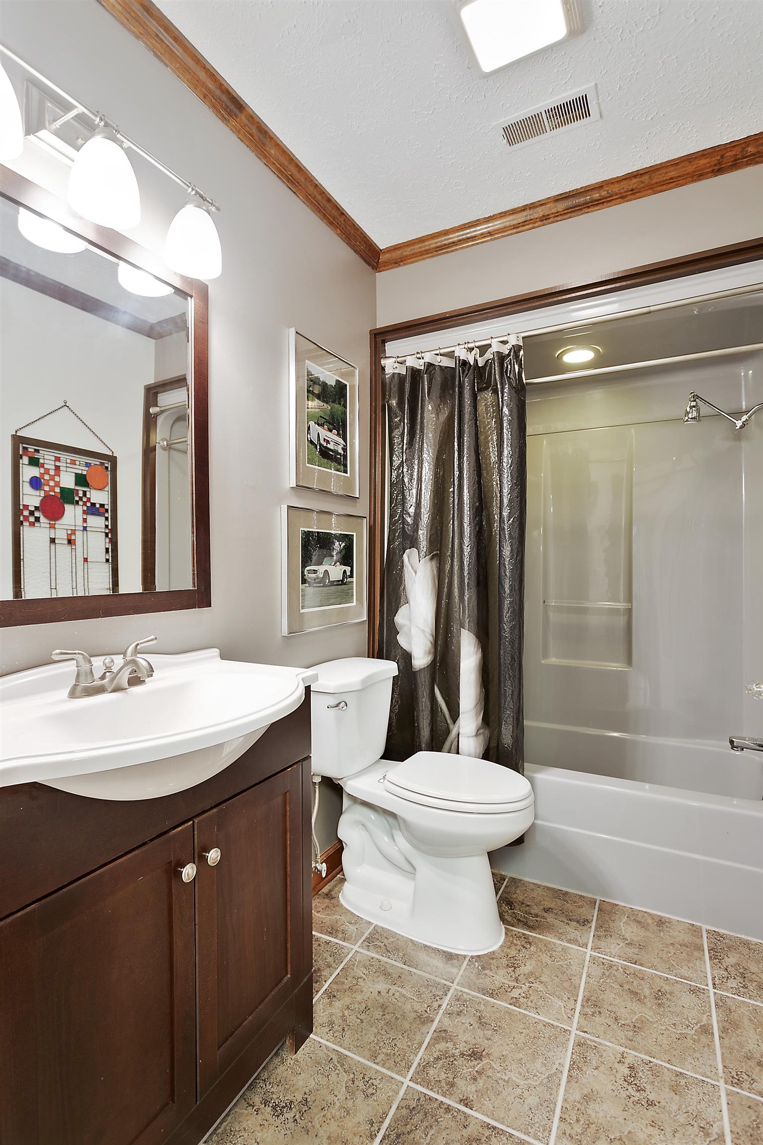 1534 Iron Bridge Road Columbia, TN 38401 - Photo 24 of 30 a bathroom with a sink a toilet and shower