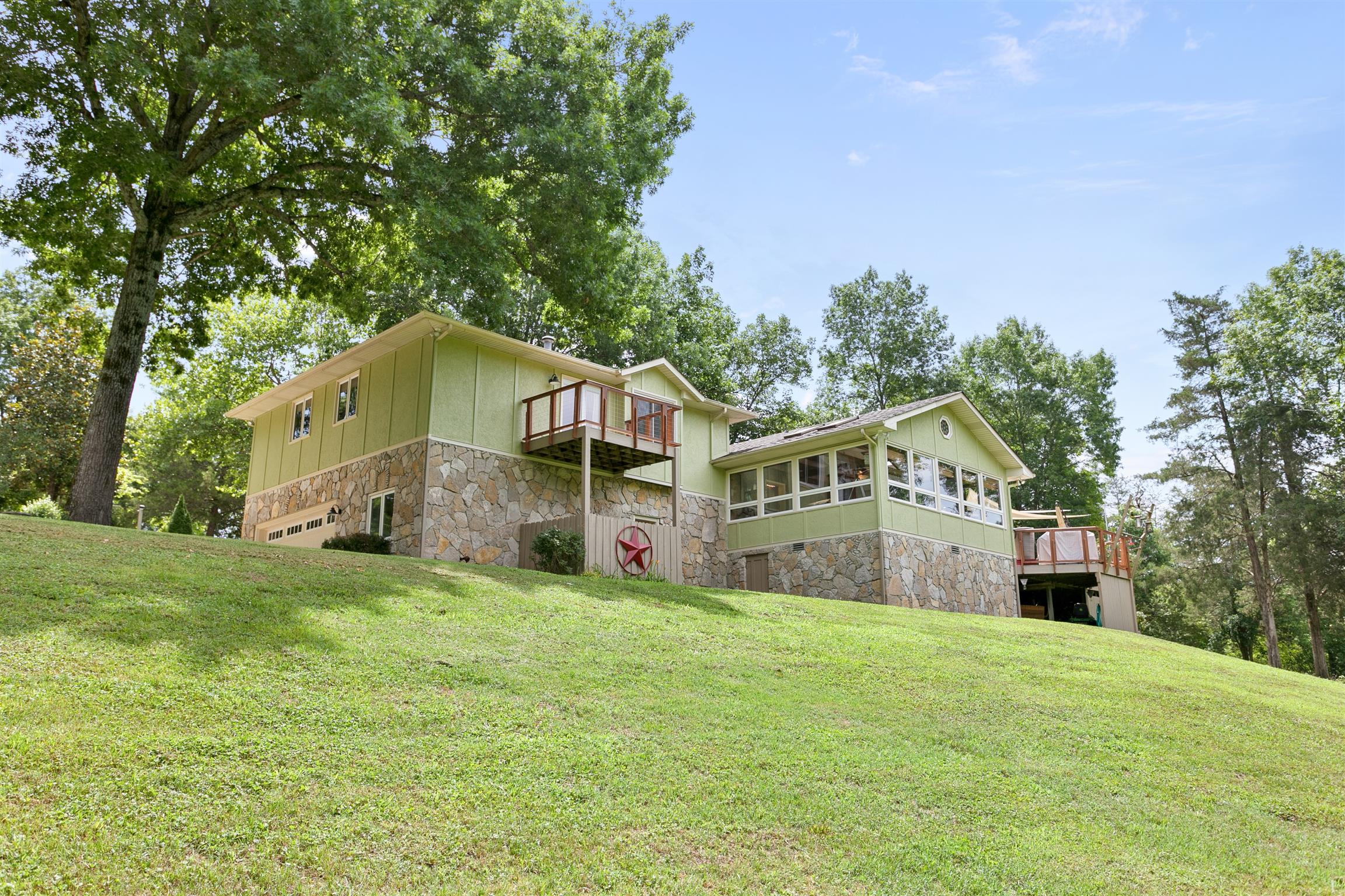 1534 Iron Bridge Road Columbia, TN 38401 - Photo 30 of 30 a front view of a house with a yard and large trees