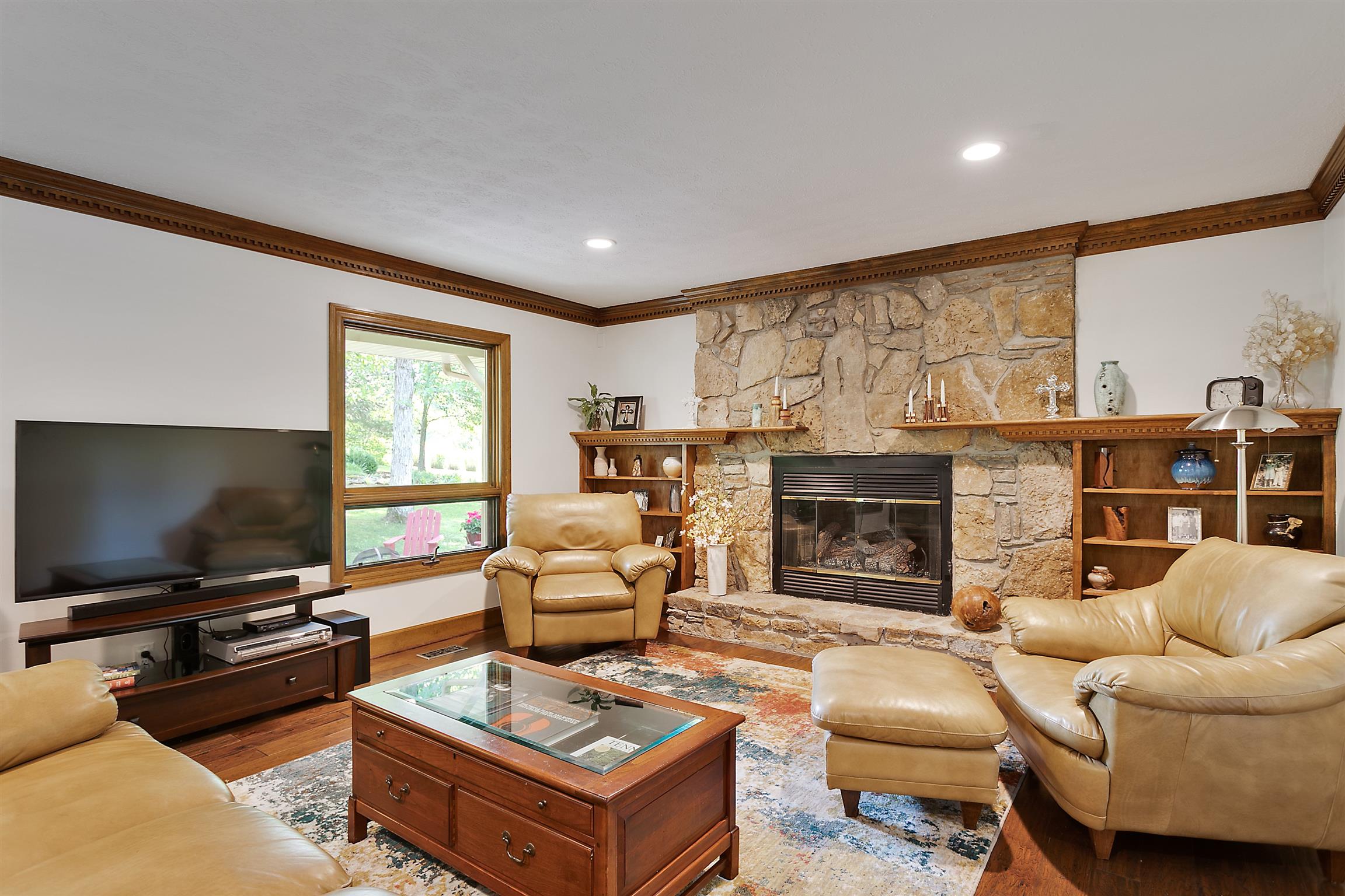 1534 Iron Bridge Road Columbia, TN 38401 - Photo 8 of 30 a living room with furniture a flat screen tv and a fireplace