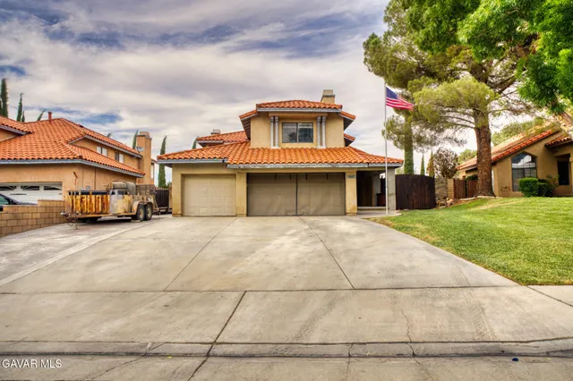 a front view of a building with a garden